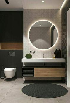 a bathroom with a round mirror above the sink