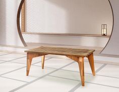 a wooden table sitting on top of a white tiled floor next to a round mirror