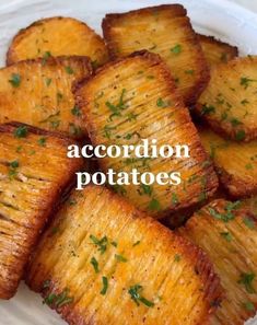 a white plate topped with potatoes covered in parsley