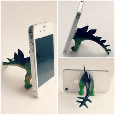 an iphone with a green toy dinosaur attached to it's back and in front of the phone