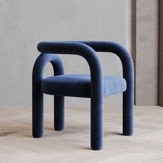 two blue chairs sitting on top of a wooden floor