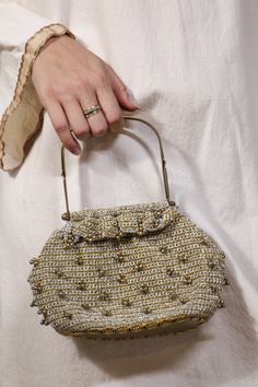 "Adorable beaded crochet handbag, has bronze metal structured straps. Clear bottom. Very cute and perfect for a glimmering night out. 9\" wide 5\" long" Elegant Crochet Bag With Gold-tone Hardware, Vintage Embellished Bag As Fashion Accessory, Vintage Embellished Bag, Gold Beaded Clutch For Everyday Use, Elegant Beaded Crochet Bag, Vintage Evening Shoulder Bag With Pearl Handle, Chic Gold Crochet Evening Bag, Gold Vintage Shoulder Bag, Vintage Embellished Evening Bag