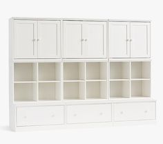 a white bookcase with drawers and doors on the bottom shelf in front of a white background