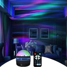 an image of a living room setting with remotes on the table and colorful lights in the ceiling