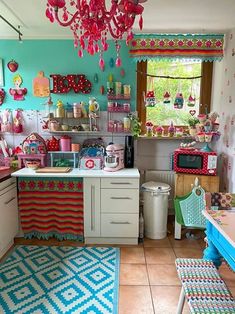 a kitchen filled with lots of colorful items