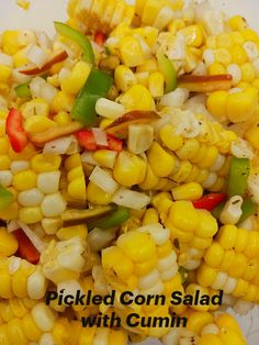 a pile of corn is shown with peppers and onions on it, along with the words pickled corn salad with cumin