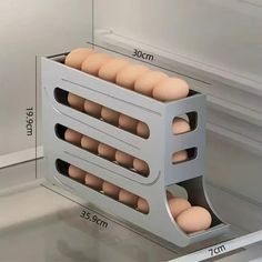 an egg tray with six eggs in it and measurements for the size to be shown