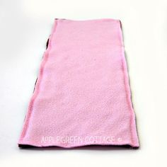 a pink towel is laying on the floor