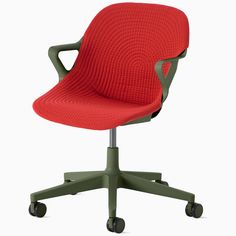 an office chair with wheels and a red seat cover on the back, in front of a white background