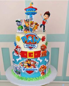 a birthday cake with paw patrol characters on it