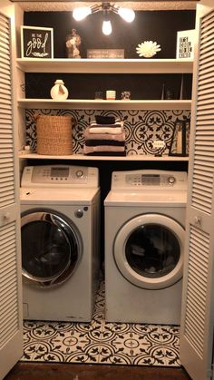 a washer and dryer in a closet with an open door to the other side