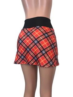 Step up your game in this fun and colorful athletic skirt with built in compression shorts and pocket. This golf, tennis, running or sports skirt is slim-style, but allows for plenty of movement, made of a red plaid high quality performance spandex. The compression shorts are uniquely designed to be incredibly comfortable and won't ride up during activity. The pocket is positioned on the side of the shorts, and will fit your phone, keys, ID, etc. *Please see size chart in images above for standa Fitted Mini Skirt With Built-in Shorts For Tennis, Casual Fitted Swim Skirt For Sports, Tennis Mini Skirt With Built-in Shorts And Stretch, Fitted Mini Skirt With Built-in Shorts For Cheerleading, Fitted Lined Swim Skirt For Sports, Fitted Tennis Skort With Elastic Waistband, Fitted Tennis Swim Skirt With Elastic Waistband, Casual Fitted Tennis Skort, Casual Mini Skirt With Built-in Shorts For Cheerleading