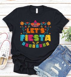 Let's Fiesta - Cinco De Mayo Shirt, Fiesta Shirt,Cinco De Mayo Fiesta Shirt,Bride Sombrero Shirt, Mexican Fiesta Shirt, Funny Drinking Shirt ------------------------------------------------------- A B O U T - T H I S - T S H I R T ------------------------------------------------------- Let's Fiesta - Cinco De Mayo Shirt, Fiesta Shirt,Cinco De Mayo Fiesta Shirt,Bride Sombrero Shirt, Mexican Fiesta Shirt, Funny Drinking Shirt Available in size : XS, S, M, L, XL, 2XL, 3XL Available in color  * Blac Mexican Festival, Fiesta Shirt, Funny Drinking Shirts, Festival Shirt, Tequila Shirt, 5 De Mayo, Mexican Girl, Festival Shirts, Bachelorette Party Shirts