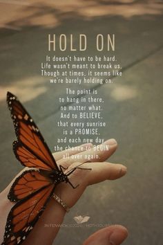 a person holding a butterfly in their hand with the words hold on written below it