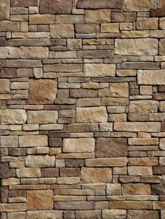 a stone wall that has been made out of various types of stones and is brown