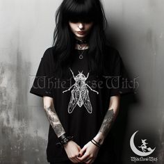 Unleash your dark side with this Vintage Housefly Insect T-Shirt, perfect for those who embrace the goth, emo, and edgy alt fashion scene. Featuring a meticulously detailed vintage drawing of a housefly, this shirt blends a classic entomology aesthetic with a dark and mysterious vibe. Whether you're deep into the gothic culture, love the eerie charm of insects, or simply want to make a bold statement, this tee is a must-have addition to your wardrobe. Crafted from soft, high-quality fabric, this Entomology Aesthetic, Fly Insect, Gothic Culture, Punk Clothing, Vintage Drawing, Punk Outfits, Alt Fashion, Vintage Grunge, Alternative Outfits