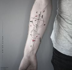 a man's arm with a tattoo on it that has lines and dots all over it