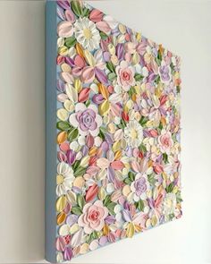 a painting on the wall with flowers painted on it