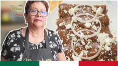 a woman standing in front of a plate of food with onions and cheese on it