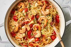 pasta with shrimp and tomatoes in a pan