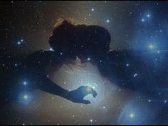 the silhouette of a person holding their hand out in front of stars