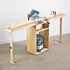 a workbench with tools in it on the floor