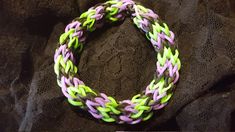 "This bracelet has a strange name, but fun to wear! Orchid purple, neon-lime green & black rainbow loom bracelet. I was following a pattern on the Monster Tail and kinda got lost and came up with my own design. Fits a womens 7-8\" wrist size." Monster Tail Loom, Rubberband Bracelets, Monster Tail, Rainbow Loom Bracelets Easy, Fishtail Bracelet, Rainbow Loom Bracelet, Rainbow Loom Designs, Rainbow Braids, Loom Designs