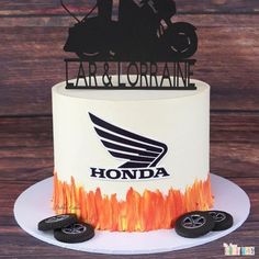 a motorcycle themed birthday cake on a table