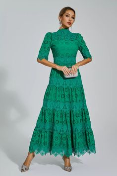 Enhance your elegance with the Kenna Green Hollow Half Sleeve Midi Dress. This exquisite dress showcases a stunning embroidered hollow design, adding a touch of sophistication to your look. Its half sleeves and midi length create a flattering silhouette, while the waistline accentuates your curves.   Dress Length: Approx 123cm Materials: Polyester Gentle Dry Clean Only  Model is 5 ft 74 and wears size S  Colour may vary due to lighting on images. The product images (without model) are closest to Dresses Event, Glitter Wedding Dress, Bandage Midi Dress, Floral Shirt Dress, Puff Sleeve Dresses, Hollow Design, Green Midi Dress, Maxi Knit Dress, Midi Dress With Sleeves