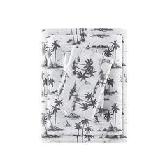 a white sheet with black palm trees on it