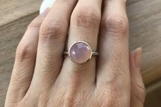 "A simple yet classic round faceted Pink Chalcedony Sterling Silver Ring featuring a comfort fit band with a bezel around the stone. It can be stacked with our other gemstone rings. Wrapped in a box ready for gift giving.(r-nc-84) RING INFO ---------------- STERLING SILVER 10MM (0.39inches) *Follow us @belesasjewelry on Instagram for promotions/giveaways *LIKE* us on Facebook http://www.facebook.com/Belesas to find special coupon codes *If you like the ring, please click on the \"Pin It\" icon - Slider Necklace, Gold Chevron, Chalcedony Ring, Statement Drop Earrings, Pink Ring, Pink Quartz, Womens Wedding Bands, Rings Simple, Quartz Rose