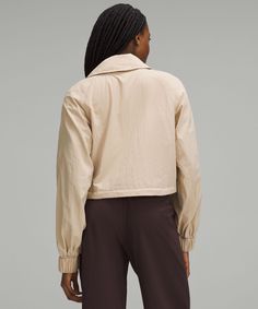 With Its Cropped And Blousy Silhouette, This Lightweight Jacket Is The Finishing Touch To Any Outfit. Wear It Relaxed Or Cinched Close To Your Waist For A Different Look. Designed For Casual. Relaxed Fit Feels Roomy And Can Be Worn Over Larger Layers. Size Down If You Prefer A Slimmer Fit. Zippered Hand Pockets With Hidden Phone Sleeve. Hem Cinch Allows You To Choose Your Fit. | Cropped Trench Jacket Lululemon Casual Outerwear, Lululemon Fall Outerwear, Versatile Lululemon Tops For Fall, Versatile Long Sleeve Windbreaker For Fall, Cropped Trench Coat, Jumper Short, Lululemon Jacket, Polyester Jacket, Woven Jacket