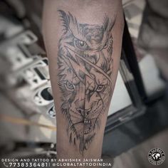 a black and grey tattoo on the leg of a man with a wolf head in it