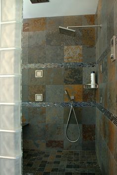 a walk in shower sitting next to a tiled wall and floor with the words walks in shower products rain shower head