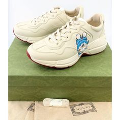 Brand New In Box 100% Authentic Gucci X Doraemon Rhyton Sneakers Limited Edition Man Size 6 Woman Us 10 Limited Edition. No More Production. Super Duper Hard To Get. Both Man And Woman Can Wear. Gucci Man Size 6 = Euro Size 40 (Woman Us Size 10) -White -Leather -Round Toe -Panelled Design -Front Lace-Up Fastening -Logo Patch At The Tongue -Branded Insole -Ridged Rubber Sole -Gucci Man Size 6, Convert To Woman Size 40 -Made In Italy - Includes Gucci Box & Dust Bag We Offer Fast Shipping And Dedic Gucci Custom Sneakers For Sports, Gucci Custom Lace-up Sneakers For Sports, White High-top Custom Gucci Sneakers, Gucci Low-top Sneakers With Abzorb Midsole, Gucci Custom Lace-up Sneakers With Embroidered Logo, Casual Custom Gucci Sneakers For Sports, Casual Custom Gucci Sneakers, Gucci Low-top Custom Sneakers For Sports, Gucci Custom Low-top Sneakers With Embroidered Logo