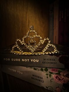 a tiara sitting on top of two books