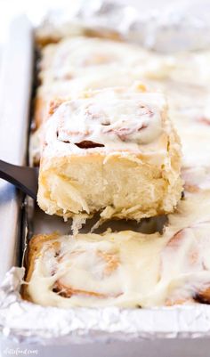 a close up of some food in a pan with a fork on it and one piece being lifted out