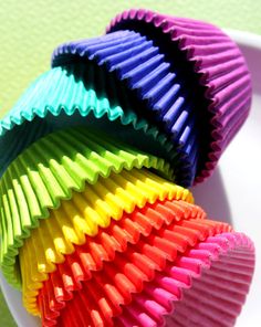 colorful cupcake liners on a white plate