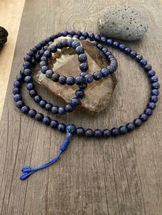 This Lapis Lazuli Mala necklace has a beautiful blue tone that will be easy to match your everyday outfits and keep you calm and grounded if you use it while meditating. Its a unique decor item also. A perfect gift for a yoga lover, or someone that loves stones. You can use it as a necklace or wrap it around the wrist and becomes a bracelet. The Mala necklace has a drop length of 43cm- 17 inch. A most have addition to your jewelry collection. ⚡️Join Akashi's VIP list for early bird discount acce Holistic Blue Beaded Bracelets, Spiritual Round Beaded Bracelets For Meditation, Spiritual Beaded Bracelets For Meditation, Spiritual Faceted Beads Jewelry For Meditation, Spiritual Style Faceted Round Beaded Necklaces, Spiritual Style Round Faceted Beads Necklace, Spiritual Blue Beaded Bracelets For Meditation, Faceted Spiritual Beads For Gifts, Adjustable Faceted Beads Bracelet For Meditation