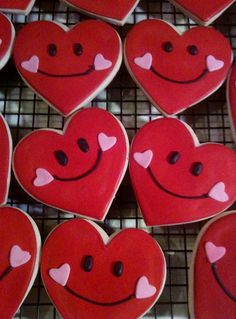 heart shaped cookies with hearts on them are arranged in the shape of smiling faces and hearts