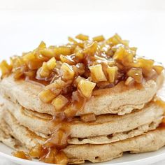 a stack of pancakes covered in caramel syrup