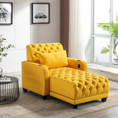 a yellow chair sitting in front of a window