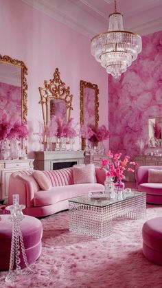 a living room with pink furniture and chandelier