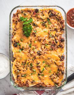 an enchilada casserole with meat, cheese and broccoli