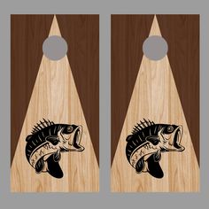 two cornholes with fish on them are shown in black and brown wood grain