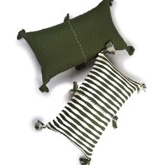 two green and white striped pillows with tassels