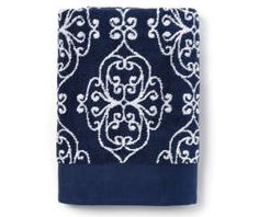 the blue and white towel has an intricate design on it's front end, while the