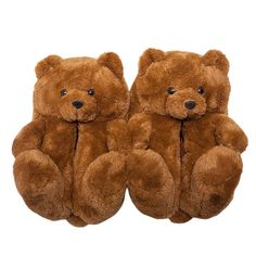 two brown teddy bears sitting next to each other