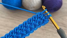 a blue crochet stitch being worked on