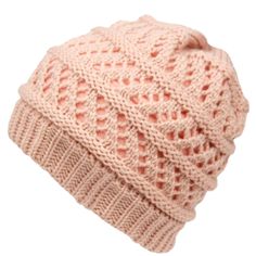 a pink knitted beanie hat with a brown label on the front and side